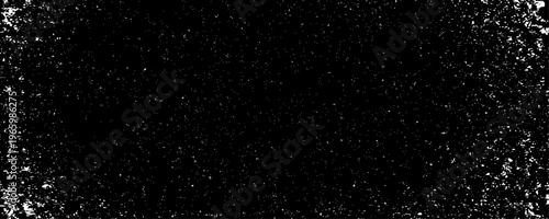 Minimalist abstract texture of scattered black specks and dust particles on a clean background.