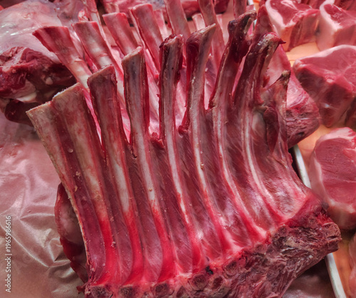 Rib bones of a rack of lamb in a butcher's cooler
