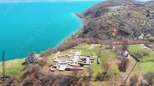 Village of Lin on the Rocky Peninsula Edge Along the Beautiful Shoreline of Lake Ohrid surrounded by emerald calm waters