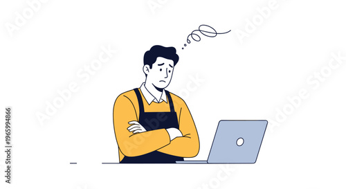 Man wearing a yellow sweater and black apron looks frustrated or worried while working on his laptop at a counter.