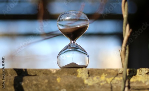 Old park and hourglass time is passing concept hurry up be in time old and modern 