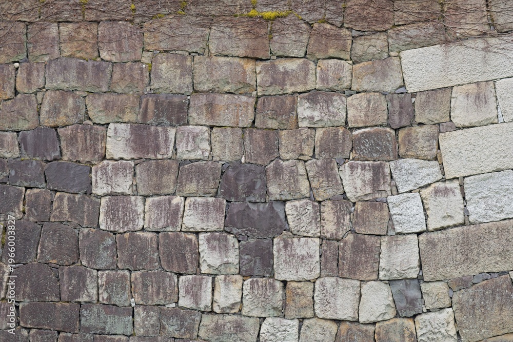 Naklejka premium Weathered stone block wall
