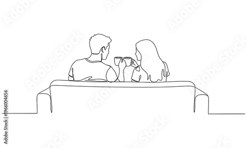 Single one line drawing back view romantic couple sitting at sofa, talking and drinking coffee. Man and woman have relaxing day off