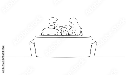Single one line drawing back view romantic couple sitting at sofa, talking and drinking coffee. Man and woman have relaxing day off