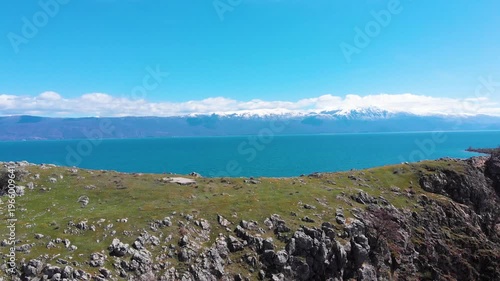 Village of Lin on the Rocky Peninsula Edge Along the Beautiful Shoreline of Lake Ohrid surrounded by emerald calm waters