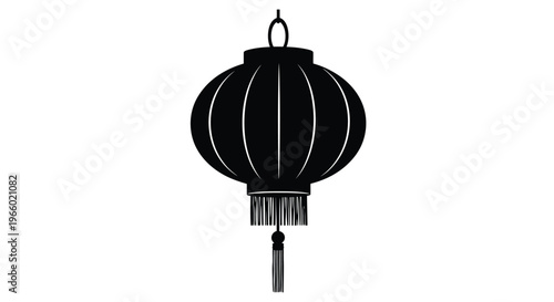 A simple black lantern design with hanging tassel a striking silhouette