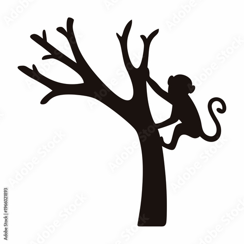 Silhouette of a playful monkey climbing a bare tree branch cheerfully