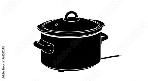 Black slow cooker with lid and handles on white background