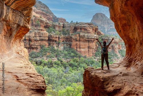 Принти на полотні Woman celebrating climb to Subway Cave in Sedona, Arizona