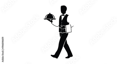 A formal waiter carries a covered dish on a silver platter presented with classic attire a striking silhouette high quality professional
