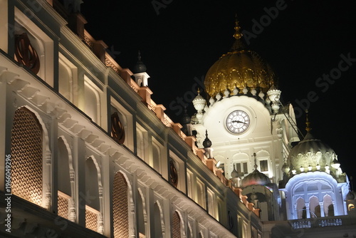 Side View of Golden Temple Building with Bright Lights
