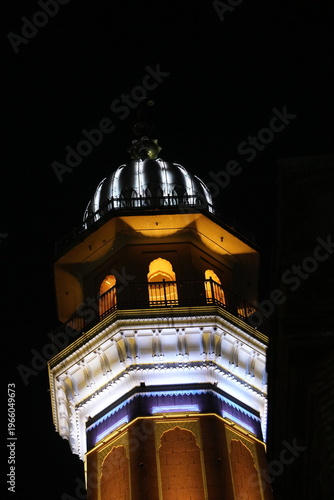 Illuminated Dome Structure at Night with Dark Background