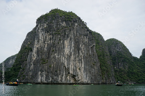 amazing rock formation in halong bay vietnam with several boats