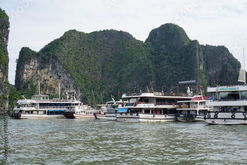 amazing rock formation in halong bay vietnam with several boats