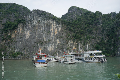 amazing rock formation in halong bay vietnam with several boats
