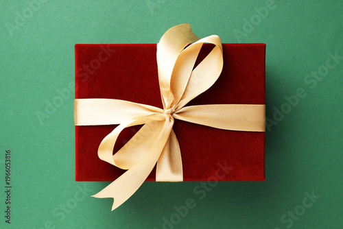 Beautiful velvet gift box on green background, top view