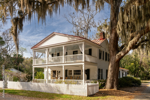 traditional southern home and live oaks with Spanish moss in historic Beaufort
