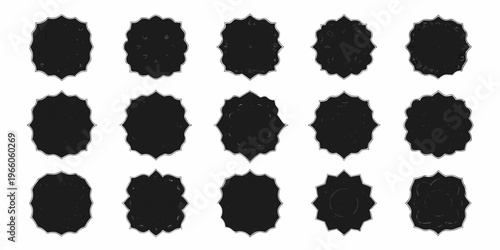 Arrangement of jagged black irregularly shaped forms on a white background