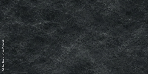 A high resolution texture of dark charcoal grey marble with subtle natural white vein patterns