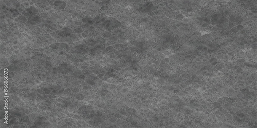 A high resolution close up of a polished dark grey marble stone surface with fine white veining