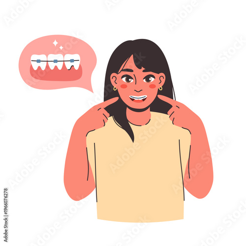 Portrait of a joyful young woman with long dark hair smiling broadly to show her teeth with orthodontic braces