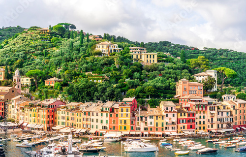 beautiful landscape of luxury resort Portofino in Luguria , Italy.  Sea coast of elite italian resort during sunset or sunrise. Beautiful bay with buildings and green mountain forest.