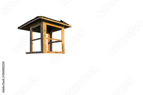 Rustic house on stilts, typical of Brazilian coastal regions; vernacular wooden dwelling with carvings on a transparent background.