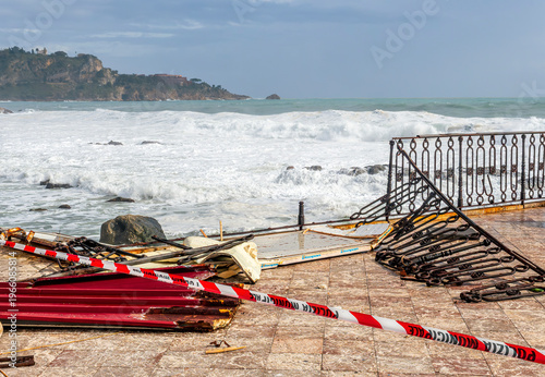 the aftermath of a powerful and devastating hurricane on a sea shore. sea coast embarkment after strong typhoon with ruins and distrustions