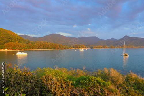 Beautiful Seascape with  boats floating in Sea at Sunset