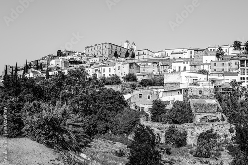 Caceres, Extremadura, Spain: Panoramic skyline of the old town of Caceres up on a hill top in black and white