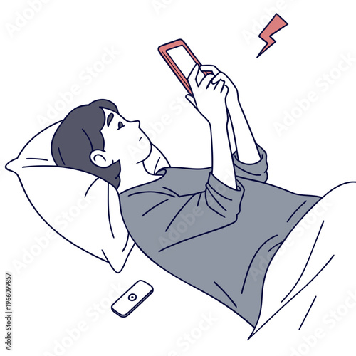 Man lying in bed with phone and alarm clock