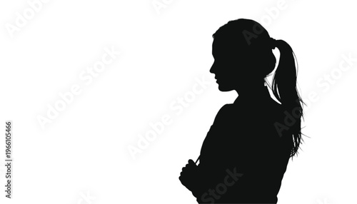 Profile silhouette of a confident woman standing with her arms folded across her chest in a firm posture.