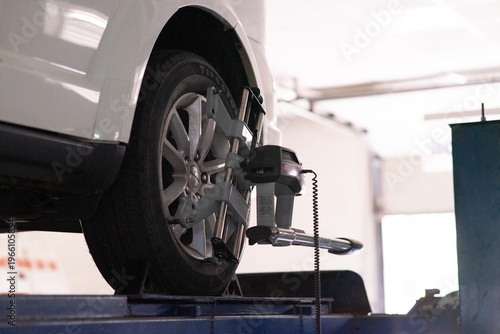 Car wheel alignment procedure in modern garage