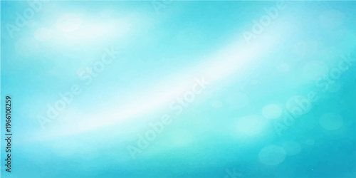 Abstract blue background with soft bokeh and bright sunlight rays shining through summer clouds like a celestial heaven over the sea