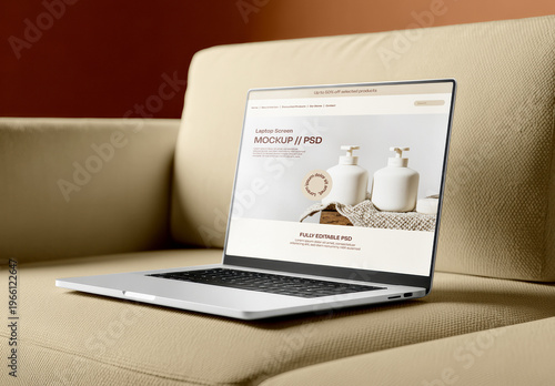 Laptop Mockup on Sofa Displaying Website