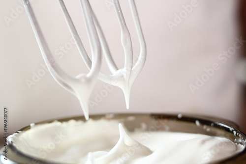 White egg peaks. Making frozen strawberry cheesecake series.