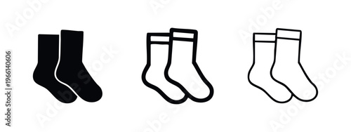 Pair of socks icon set in solid and outline styles, foot apparel symbol