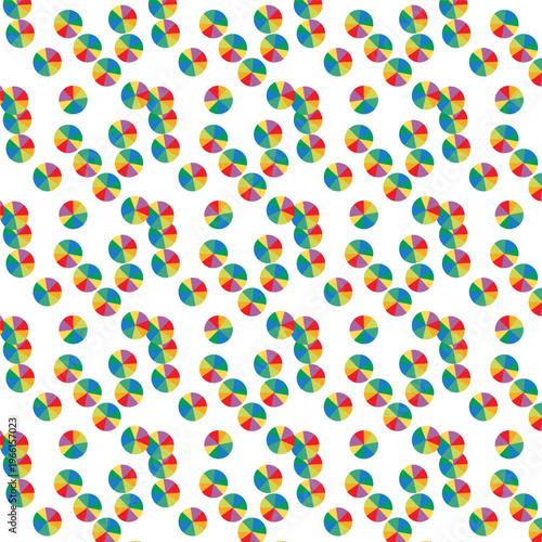 Scattered colorful pinwheel shapes on a white background, playful pattern