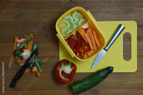 Fresh vegetables being peeled and sliced for a snack on the go. 