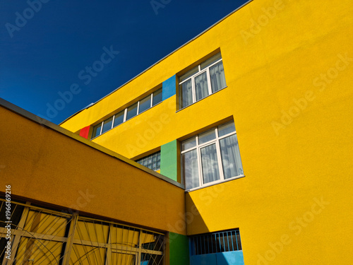 Many-coloured facade of school building