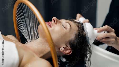Japanese head spa therapy with massage device, high-end wellness and relaxation concept.
