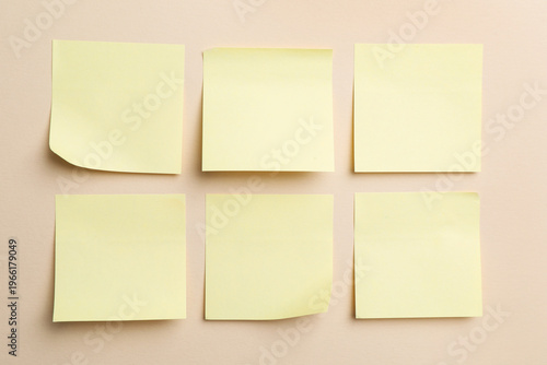 Reminder. Sticky notes on beige background, top view