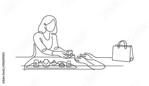 Jewelry store counter scene with sales assistant sliding a small ring box toward a customer, glass display case beneath and