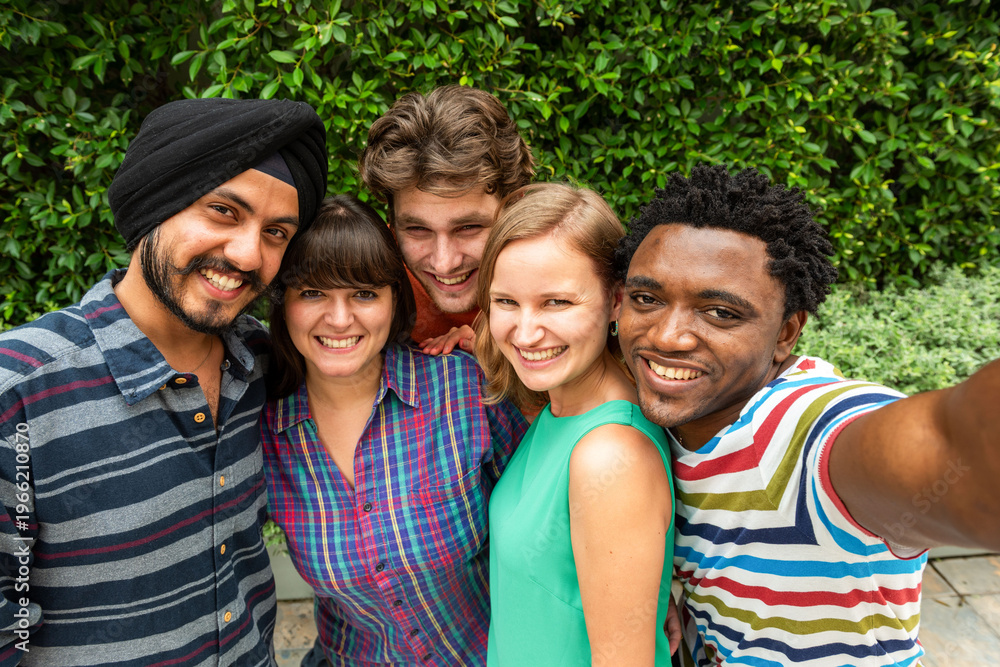Obraz premium Diverse friends smiling outdoors.