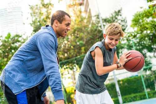 Bild auf Leinwand Outdoor basketball game with friends