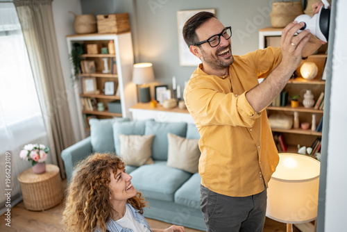 Konstfotografi Couple installing smart home security camera for safety