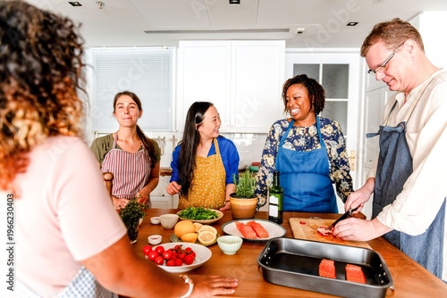 Fotografía Diverse group cooking together happily