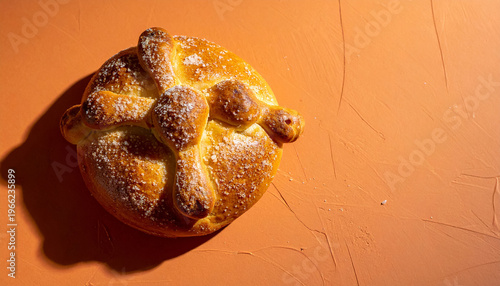 Pan de muerto bread on terracota clay