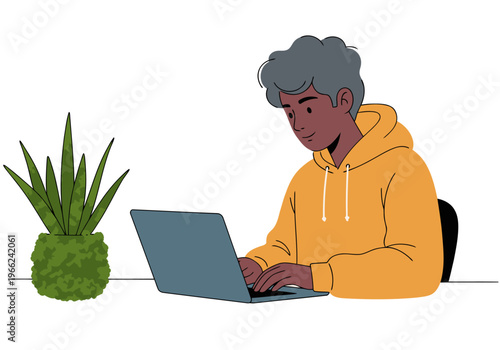A young Black man works on a laptop in a stylish home office, surrounded by greenery. Modern, professional, and focused.