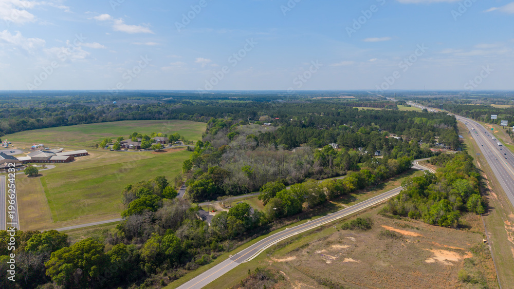Fototapeta premium Aerial shot of cars driving on the highway in Ashburn Georgia USA